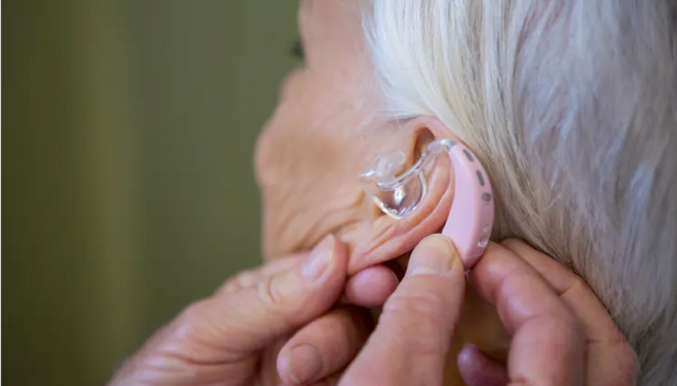 lady getting a hearing aid fitted